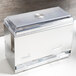 A silver Vollrath straw dispenser lid with a clear lid on top of a counter.