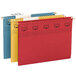 A row of Smead TUFF hanging file folders in red, yellow, and green with labels on them.
