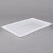 A white plastic tray with a lid.