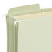 A stack of Smead FasTab TUFF file folders with green tabs.