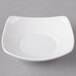 A white square Schonwald porcelain bowl with a curved edge.