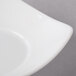 A Schonwald white porcelain bowl with a curved square edge.