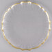 A glass Charge It by Jay plate with a scalloped clear surface and a gold rim.