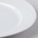 A close-up of a Schonwald Donna oval porcelain platter with a wavy design on the rim.