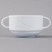 A close-up of a white Schonwald Donna two-handled soup cup.