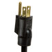 A black electrical plug with gold tips on a APW Wyott countertop warmer.
