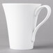 A Schonwald Continental white porcelain cup with a handle.
