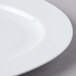 A close-up of a Schonwald white porcelain platter with a white rim.