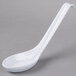 A close-up of a white Thunder Group melamine Asian soup spoon with a long handle.