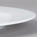 A Schonwald white porcelain plate with a small rim.