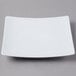 A Schonwald white square porcelain coupe plate with a white rim.