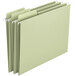 A close-up of several Smead FasTab hanging file folders with moss green tabs.