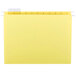 A yellow Smead file folder with white repositionable poly tabs.