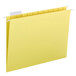 A close-up of a yellow Smead file folder with white repositionable tabs.