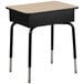 A Flash Furniture student desk with a natural laminate top and black legs.