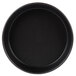 A black round pan with a black surface.
