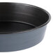 A close up of a black Matfer Bourgeat round cake pan.