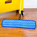 A blue Rubbermaid HYGEN wet mop pad with a black hook and loop.