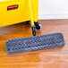 A Rubbermaid gray microfiber wet mop pad with a blue and yellow hook and loop.