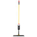 A Rubbermaid Light Commercial 18" Spray Mop with a yellow and red handle.