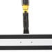A Rubbermaid Pulse 18" Spray Mop with a black and yellow handle.