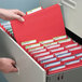 A person opening a file drawer filled with Smead FasTab hanging file folders.