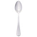 A Libbey stainless steel dessert spoon with a silver handle on a white background.