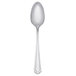 A silver Libbey Cortland teaspoon with a black handle on a white background.
