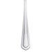 A Libbey Cortland stainless steel teaspoon with a white handle.
