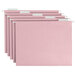 A row of pink Smead file folders with white tabs.