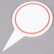 A white speech bubble with red writing and a red circle.