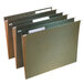 A close-up of three green Smead letter size hanging file folders with white tabs.