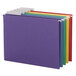 A row of Smead letter size hanging file folders in blue, green, and purple.