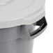 A Continental Huskee gray round trash can with a gray lid.
