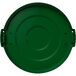 A Carlisle green plastic lid for a round trash can with a handle.
