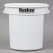 A white plastic Continental Huskee round trash can with a white lid.