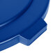 A close-up of a blue Carlisle Bronco trash can lid with a plastic handle.