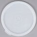 A white plastic lid with a white lid on top over a white circle.