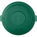 A green Carlisle Bronco plastic lid for a circular trash can with handles.