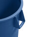 A blue Carlisle round plastic trash can with a handle.