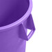 A purple Carlisle round trash can with a handle.