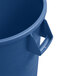 A close-up of a blue Carlisle round plastic trash can with a handle.