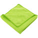 A folded green Unger SmartColor Microfiber Cleaning Cloth.