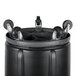 A black Rubbermaid BRUTE round trash can on a dolly with wheels.