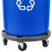 A blue Rubbermaid recycling bin on a white dolly.