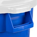 A blue Rubbermaid recycling bucket with a white lid.
