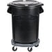 A Rubbermaid black garbage can with a lid and wheels.