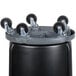 A black Rubbermaid BRUTE container with wheels.