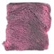 A pink and grey steel wool soap pad with black threads.