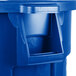 A blue Rubbermaid recycling can with lid.
